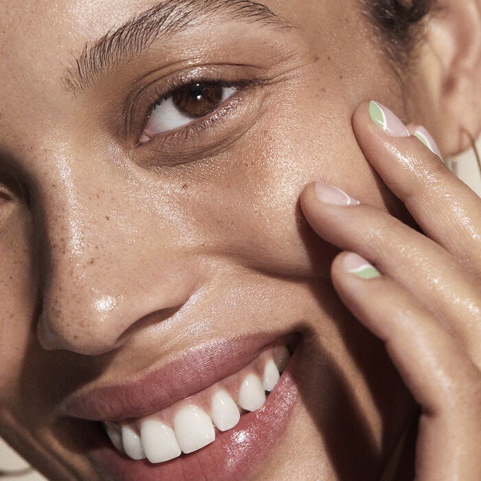 woman applying facail oil