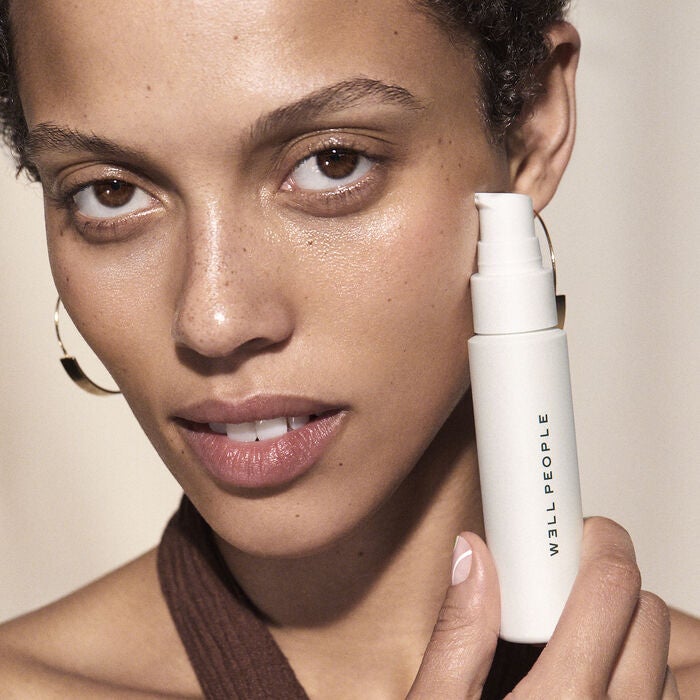 model holding well people brightening serum