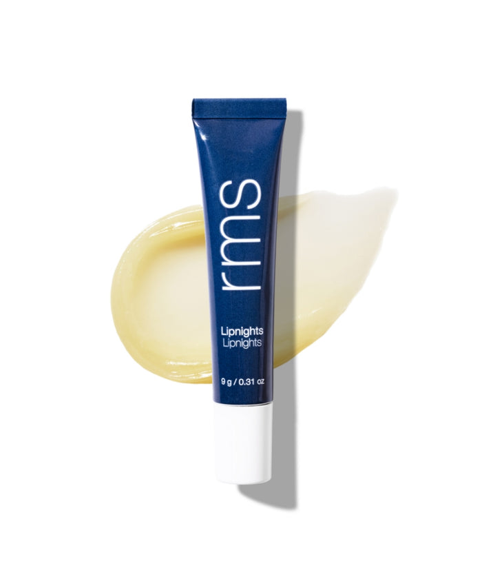 Tube of Lipnights Overnight Lip Mask in navy blue packaging resting on a smooth, creamy balm swatch with a clean white background.