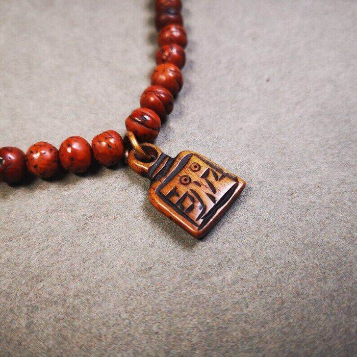 Yak Bone Carved Letter Prayer Bead Pendant - Tibetan Buddhist art, close-up detail